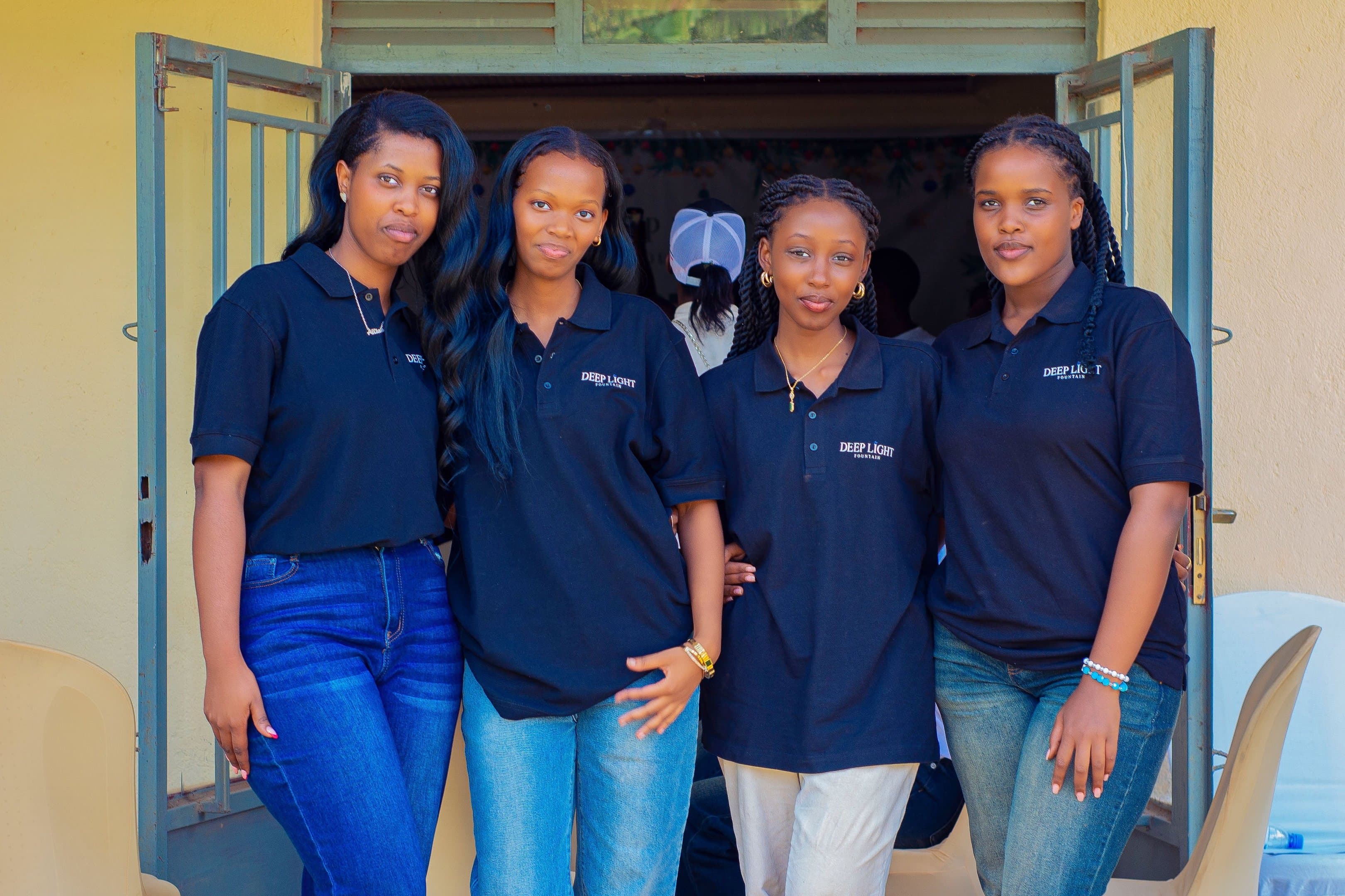Deep Light Fountain team members in branded shirts